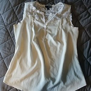 Cream sleeveless blouse